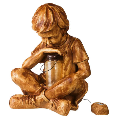 Boy with firefly light statue